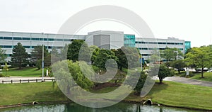 Office building with pond and fountain in a suburban setting