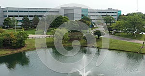 Office building with pond in a suburban setting