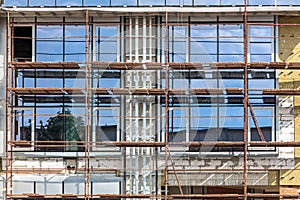 Office building under construction. scaffolding at building site