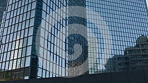 Office building windows and bottom view of skyscraper building with many corporate offices of successful companies. Real estate