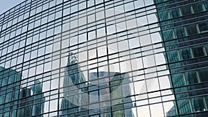 Office building windows and bottom view of skyscraper building with many corporate offices of successful companies. Real estate