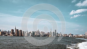 Office buildings and apartments on the skyline at sunset, from Hudson river. Real estate and travel concept. Manhattan, New York