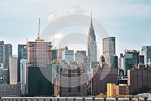 Office buildings and apartments on the skyline at sunset. Real estate and travel concept. Manhattan, New York City, USA