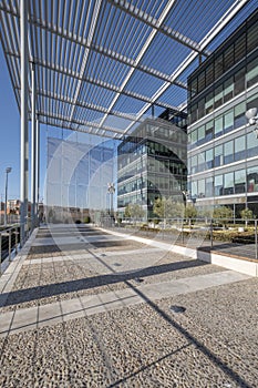 Office buildings with glass and metal facades with latticework and metal roofs photo