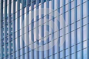 Office buildings windows. Blue glass architecture facade design with reflection of sky in urban city, Downtown Singapore City in