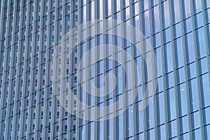 Office buildings windows. Blue glass architecture facade design with reflection of sky in urban city, Downtown Singapore City in