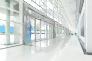 Office business building blur background of white empty room inside lobby hall interior, medical clinic hallway, or airport