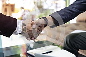 The office business team as selective focus of the deal which handshake man and Success concept of handshaking after successful