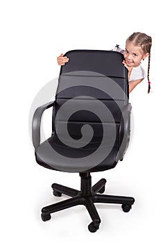 Office chair office chair and little cheerful girl isolated on white background. Modern adjustable chair from black