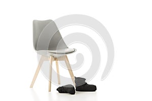Office Chair and Pair of Back Shoes on White
