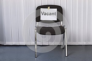 Office chair with a vacant sign