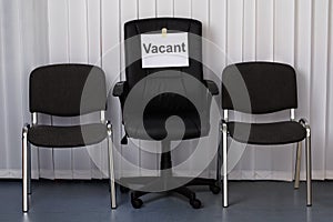 Office chair with a vacant sign