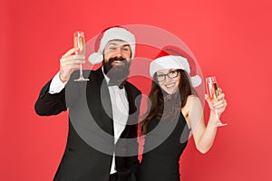 Office christmas party. merry christmas and cheers everyone. business man and girl drink champagne. xmas party. formal
