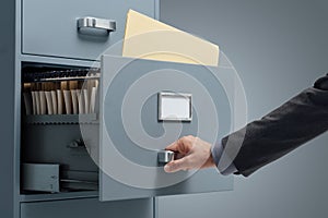 Office clerk searching files photo
