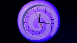 Office clock on black background, night