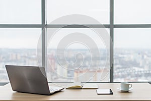 Office. Comfortable work table, workplace with notebook laptop.