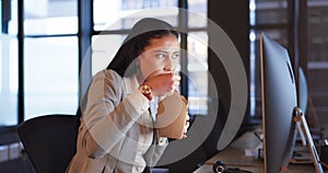 Office, computer and woman with fast food at desk, reading email or online report for project at digital agency. Dinner