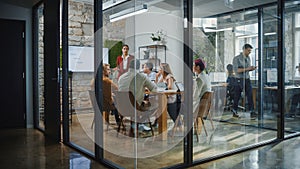 Office Conference Room Meeting: Female Chief Executive Talking to a Diverse Team of Professional B