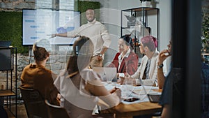 Office Conference Room Meeting: Male Chief Executive Talking to a Diverse Team of Professional Bus