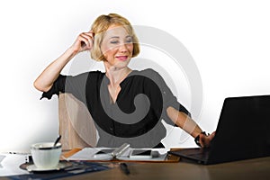 Office corporate portrait of young beautiful and happy business woman working relaxed at laptop computer desk smiling confident in