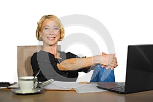 Office corporate portrait of young beautiful and happy business woman working relaxed at laptop computer desk smiling confident in