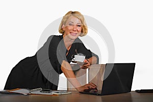 Office corporate portrait of young beautiful and happy business woman working relaxed at laptop computer desk smiling confident in