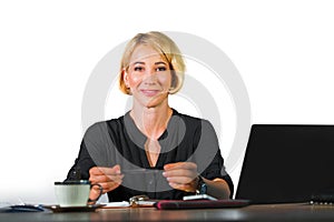 Office corporate portrait of young beautiful and happy business woman working relaxed at laptop computer desk smiling confident in