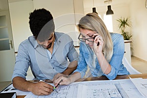 Office coworkers in business meeting discussing project plans