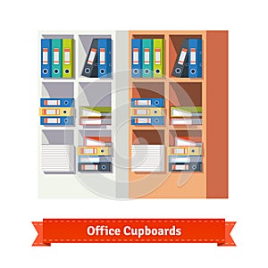 Office cupboards full of ring binders and papers