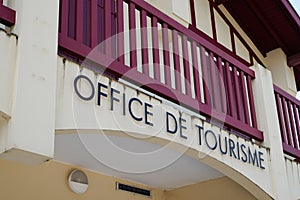 Office de tourisme france text means tourism agency sign in French language