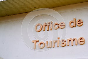 Office de tourisme French tourism office sign on wall building tourist help