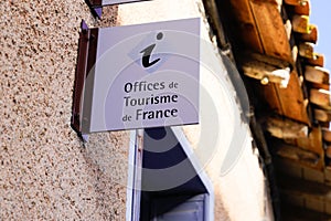 Office de tourisme French tourism office sign on wall in France