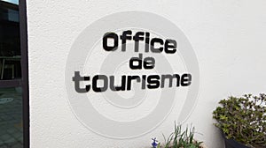 Office de tourisme French tourism office text sign on wall building facade agency in