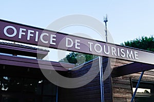 Office de tourisme sign text in French means tourism office on wall agency in France