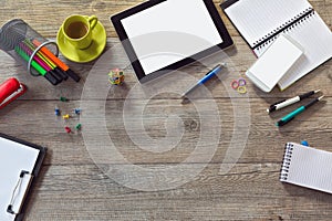 Office desk background with tablet, smart phone and cup of coffee. View from above with copy space