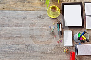Office desk background with tablet, smart phone and cup of coffee. View from above with copy space