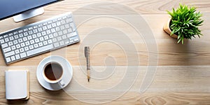 Office Desk with Computer and Coffee Cup Top View photo