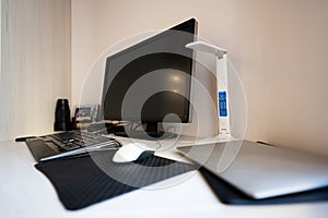 Office desk with computer, mouse, notebook and pen. Workplace concept