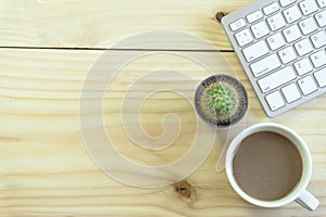 Office desk with copy space. Digital devices wireless keyboard and mouse on office table with notepad and cup of coffee,you can ap