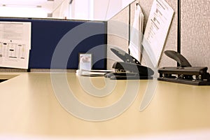 Office desk with Hole Puncher and Stapler photo