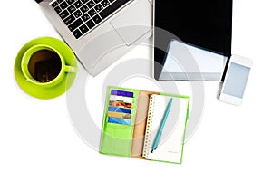 Office desk with laptop computer, tablet pc, planner