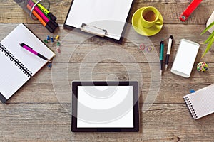 Office desk mock up template with table, smart phone, notebook and cup of coffee. View from above with copy space