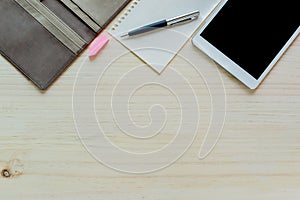Office desk mock up template with tablet, notebook and pen. View