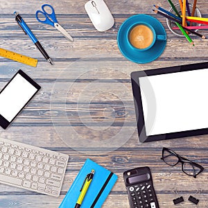 Office desk mock up template with tablet, smartphone and office items on wooden table