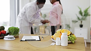 Office desk with products, medicine and paper at doctor's