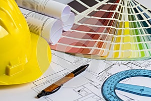 An office desk with the project papers