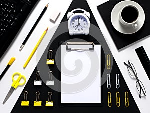 Office desk table of Business workplace and business objects. White, black, yellow work space.