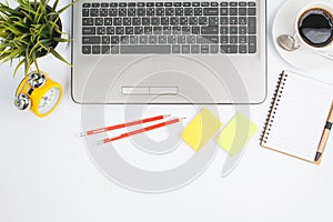 office desk table with computer supplies flower and coffee cup t