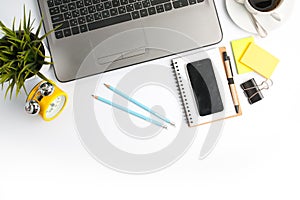 office desk table with computer supplies flower and coffee cup t