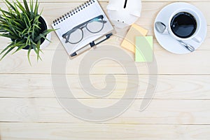 office desk table with computer supplies flower and coffee cup t